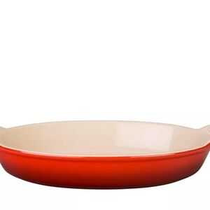 Le Creuset Heritage Oval Au Gratin Dish in the color Cerise (red) Stoneware